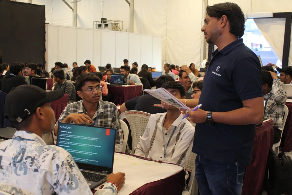 Jaydeep Adesara mentoring participants during a technology event