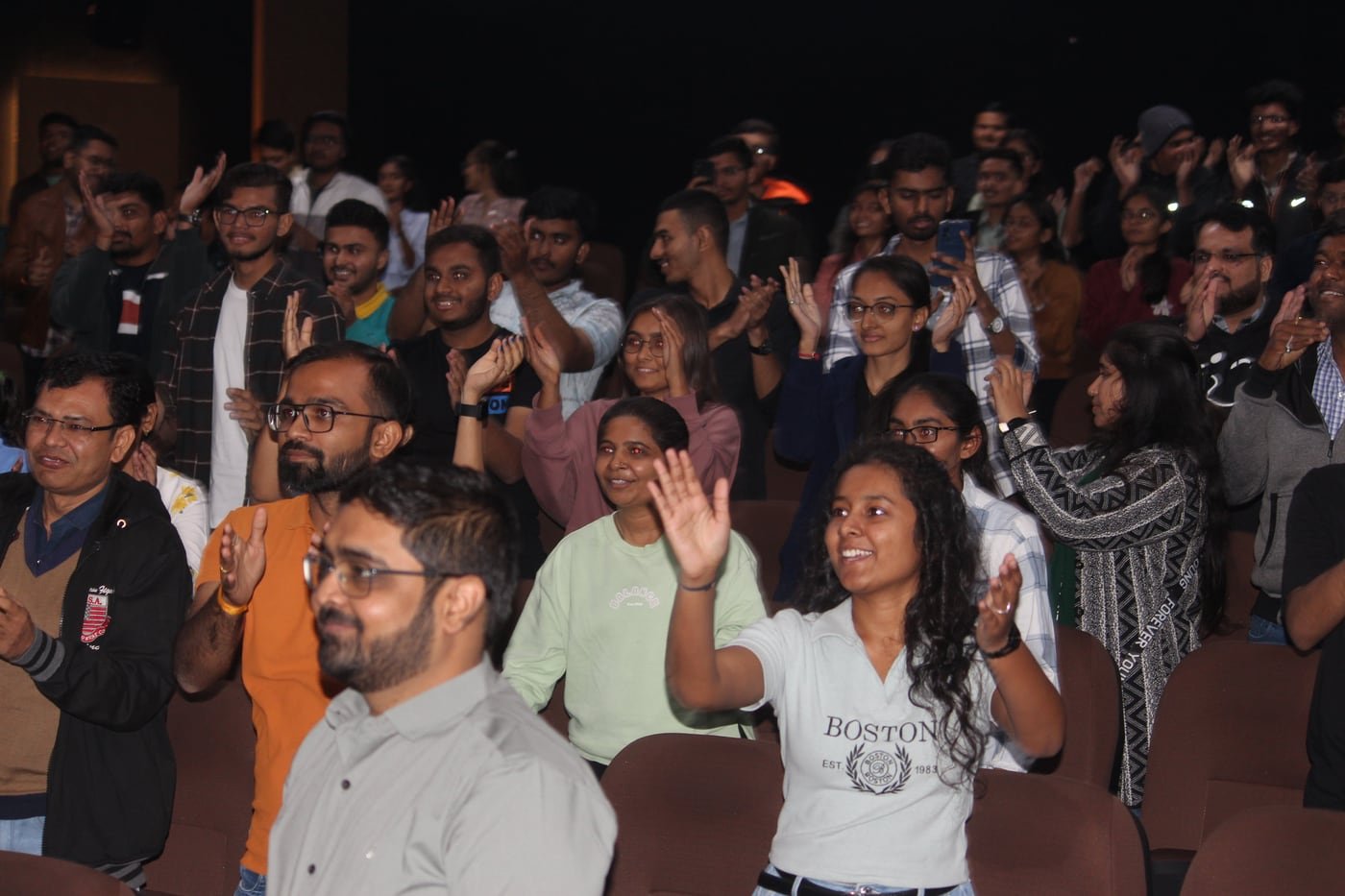 Community members applauding during an FFDG Rajkot event