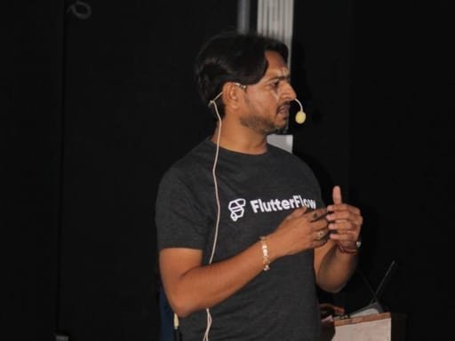 Jaydeep Adesara, FlutterFlow Community Champion, speaking at a developer meetup