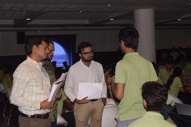 Jaydeep Adesara listening to a participant during an evaluation session